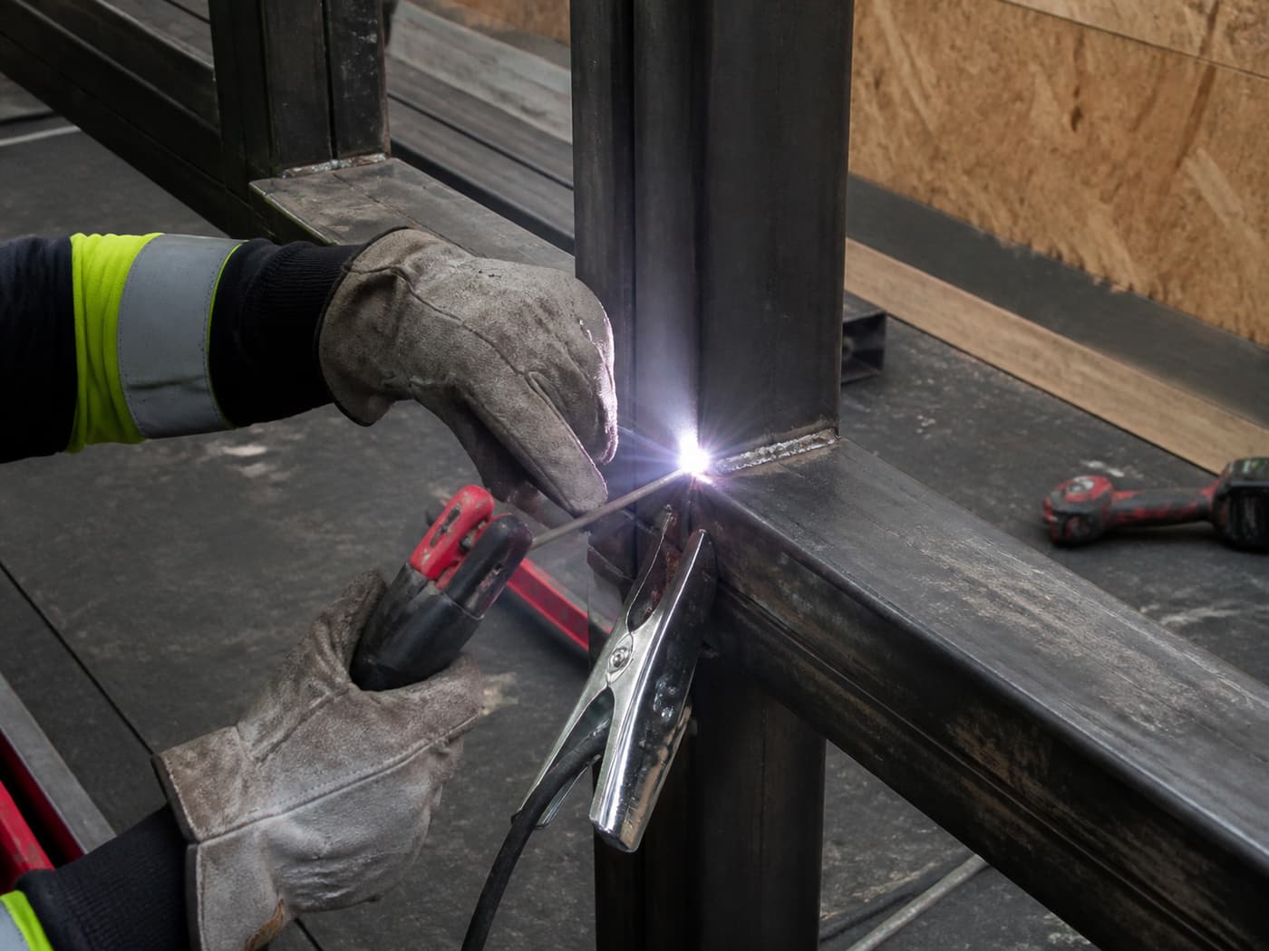 Welded metalwork being fabricated and installed on site.